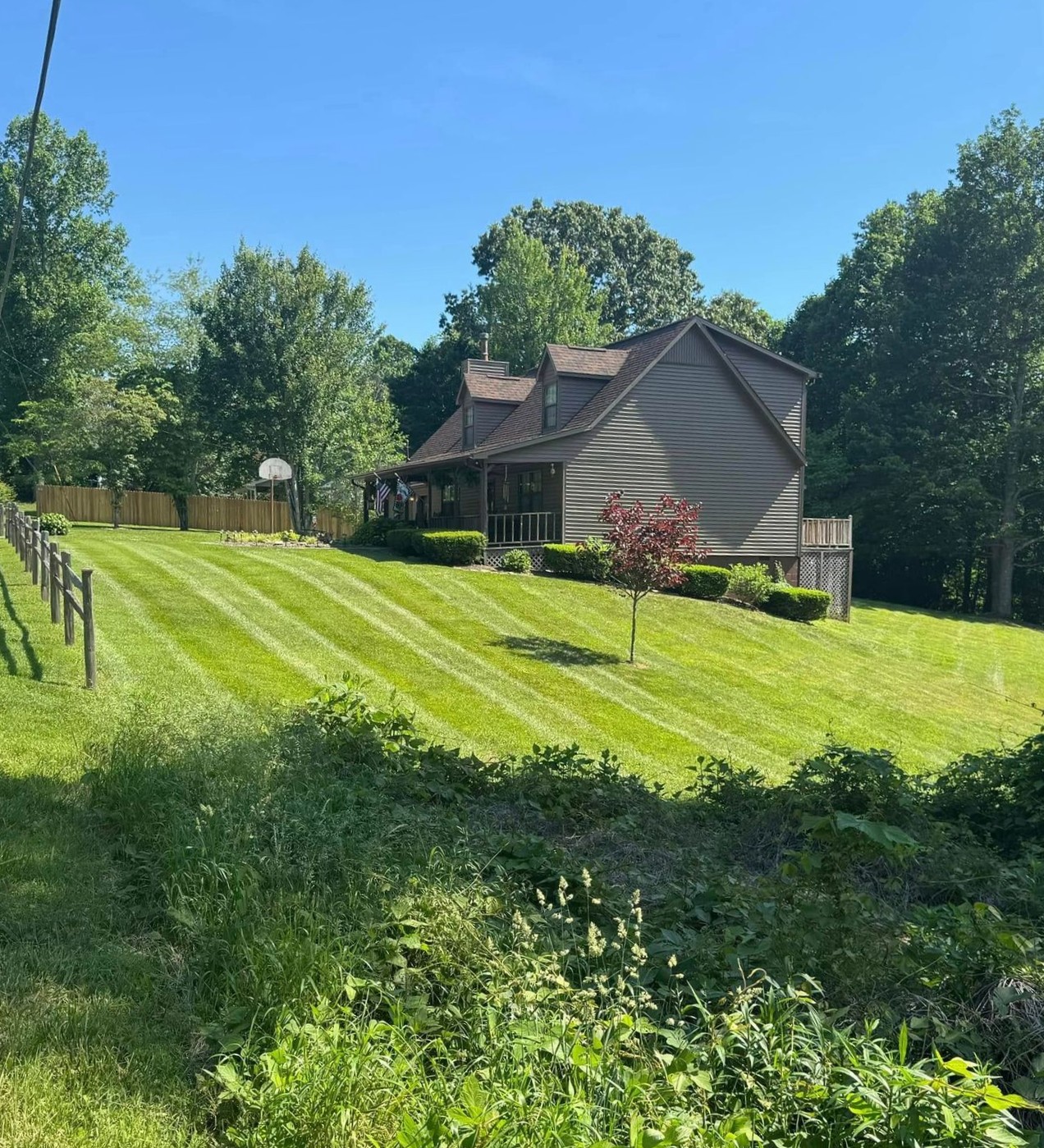 Large house and property with precise mow lines and clear property boundary